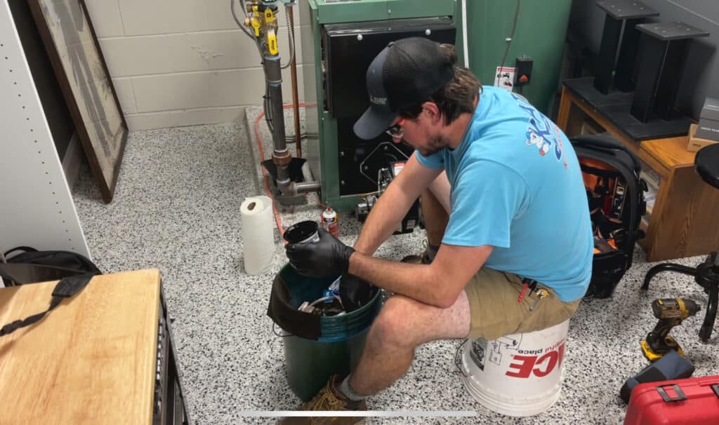 Keath HVAC tech completing a tune-up on a furnace