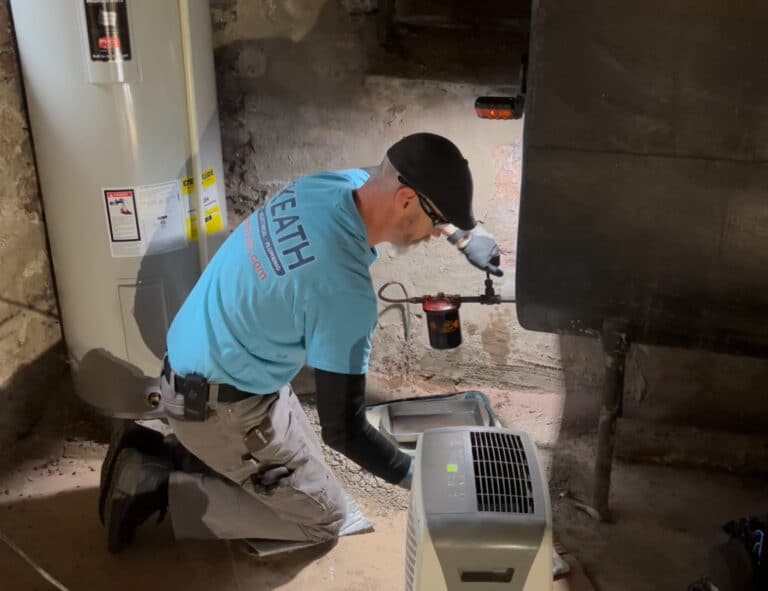 Keath HVAC tech working on heating oil tank filter